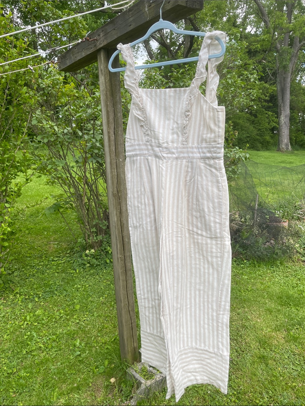 Striped Cream Ruffle-Shoulder Jumpsuit